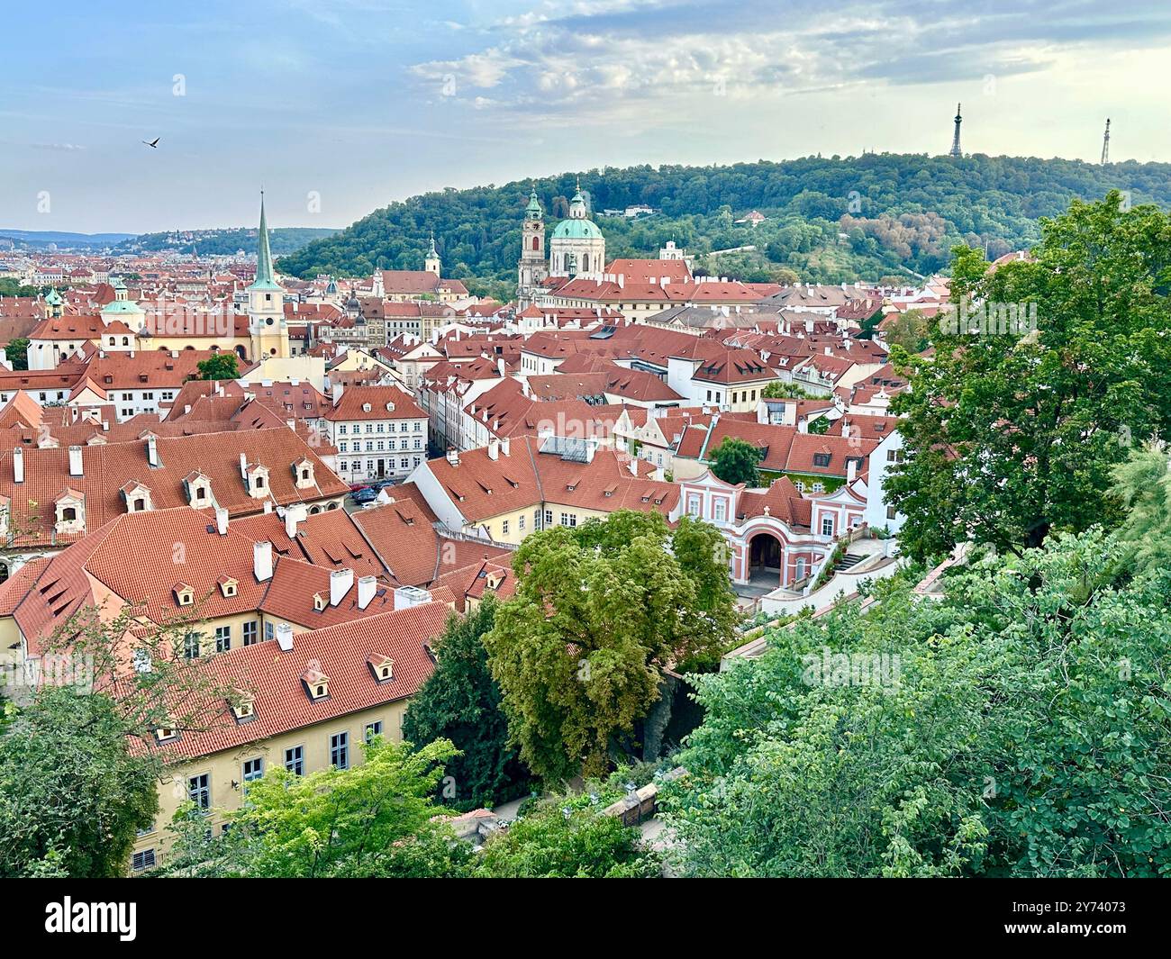 The photograph showcases a medieval European cityscape in summer, featuring vibrant rooftops and intricate architectural details. - Smartphone Captured Stock Image