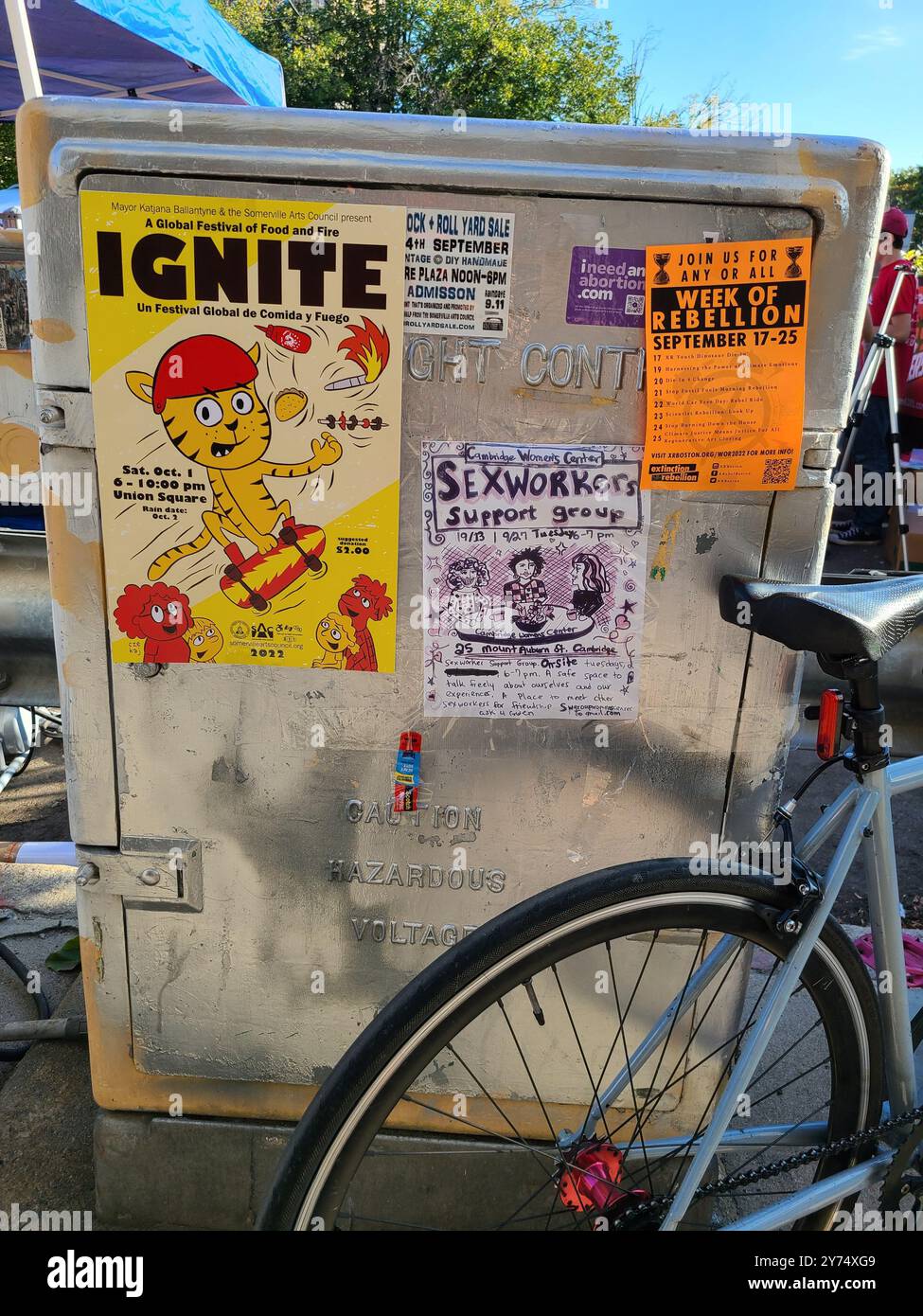 Radical want ads, and progressive notices posted on a utility box in Somerville, Massachusetts - Smartphone Captured Stock Image