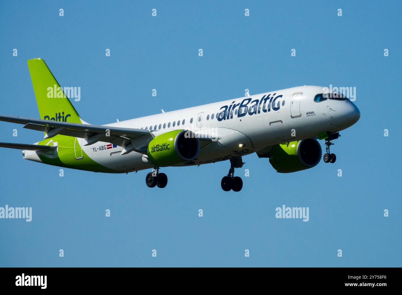 Airways Airline Airlines Operated AirBaltic Airbus A220 Commercial Plane Aircraft Airplane Aeroplane Jetliner Passenger Jet Airliner Landing Approach Stock Photo