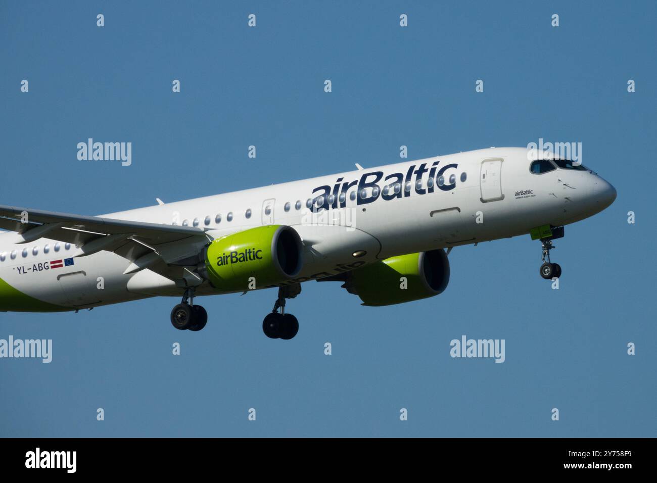 Landing Airbus A220 Air Baltic Approach Approaching Flying Flight Approaches Aircraft AirBaltic Airplane Aeroplane Jetliner Passenger Jet Airliner Stock Photo