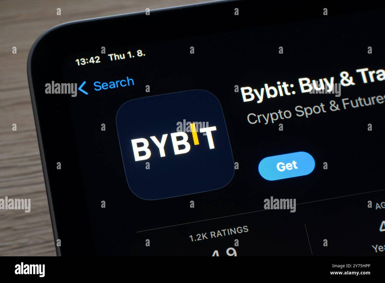 Bybit mobile app crypto exchange on mobile phone screen against blurred  cryptocurrency chart Stock Photo - Alamy