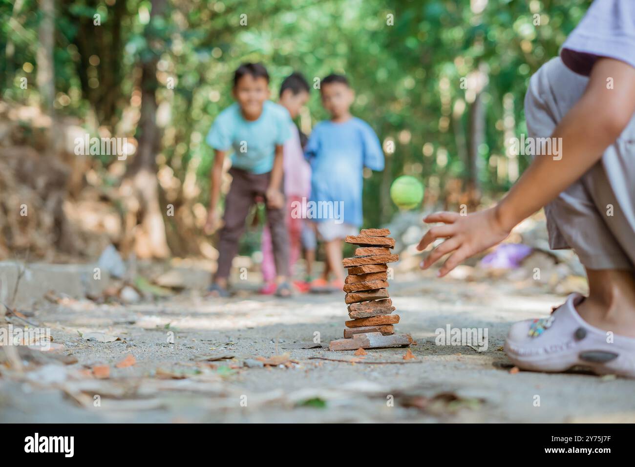 kid hand stack rooftile playing traditional game Stock Photo - Alamy
