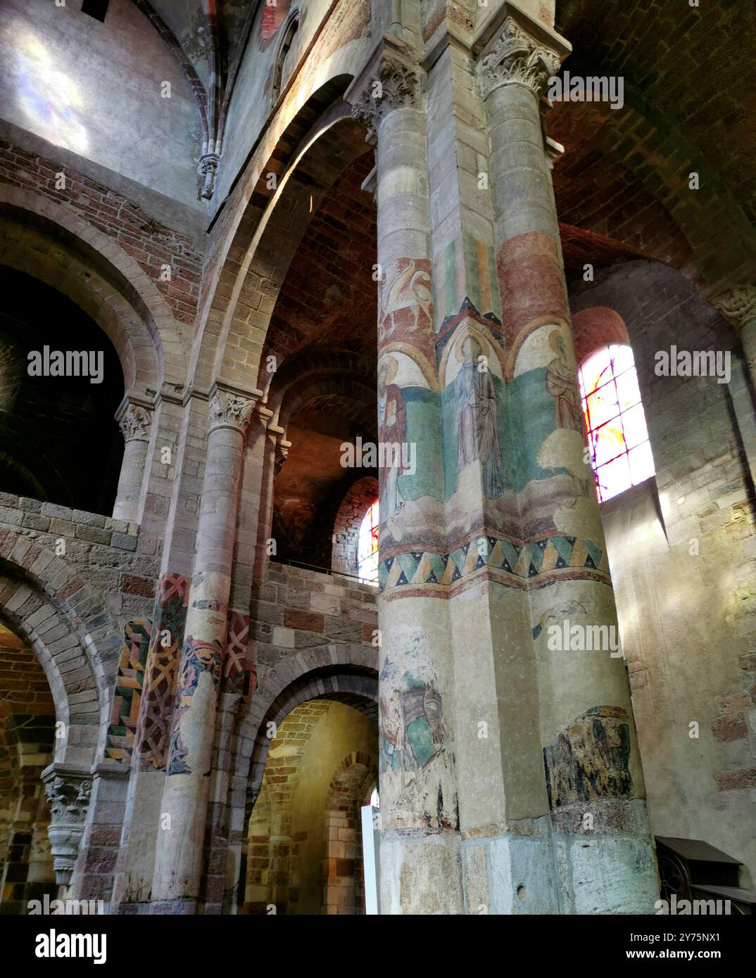 Basilica Saint Julien. Wall paintings on column. Romanesque church in Haute Loire, Auvergne-Rhone-Alpes, France. - Smartphone Captured Stock Image