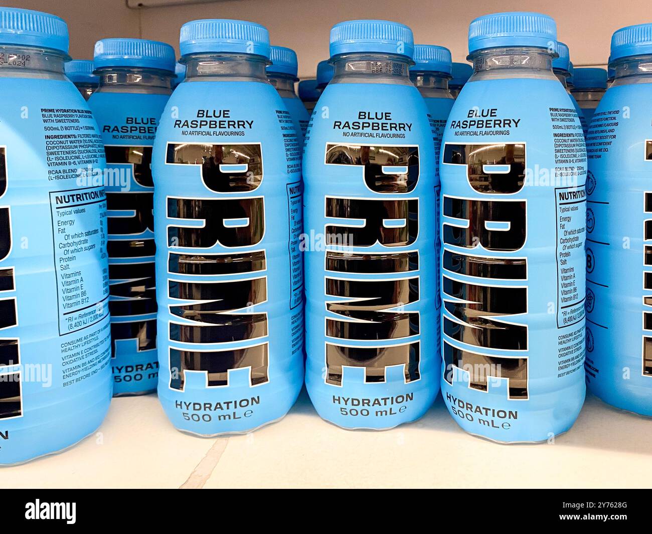 Bottles of Prime sports and energy drink on a supermarket shelf. - Smartphone Captured Stock Image