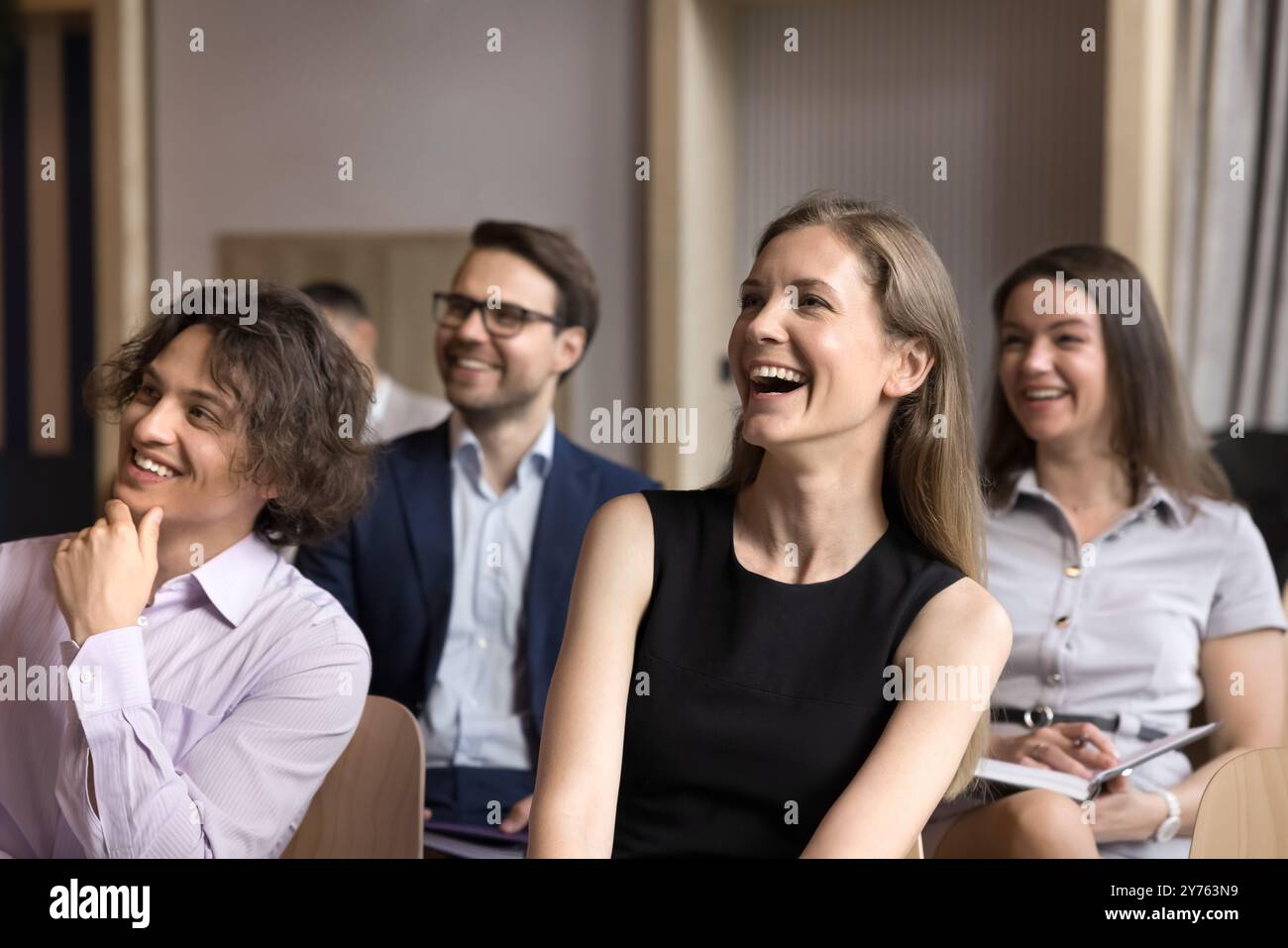 Joyful group of employees having fun at conference meeting Stock Photo