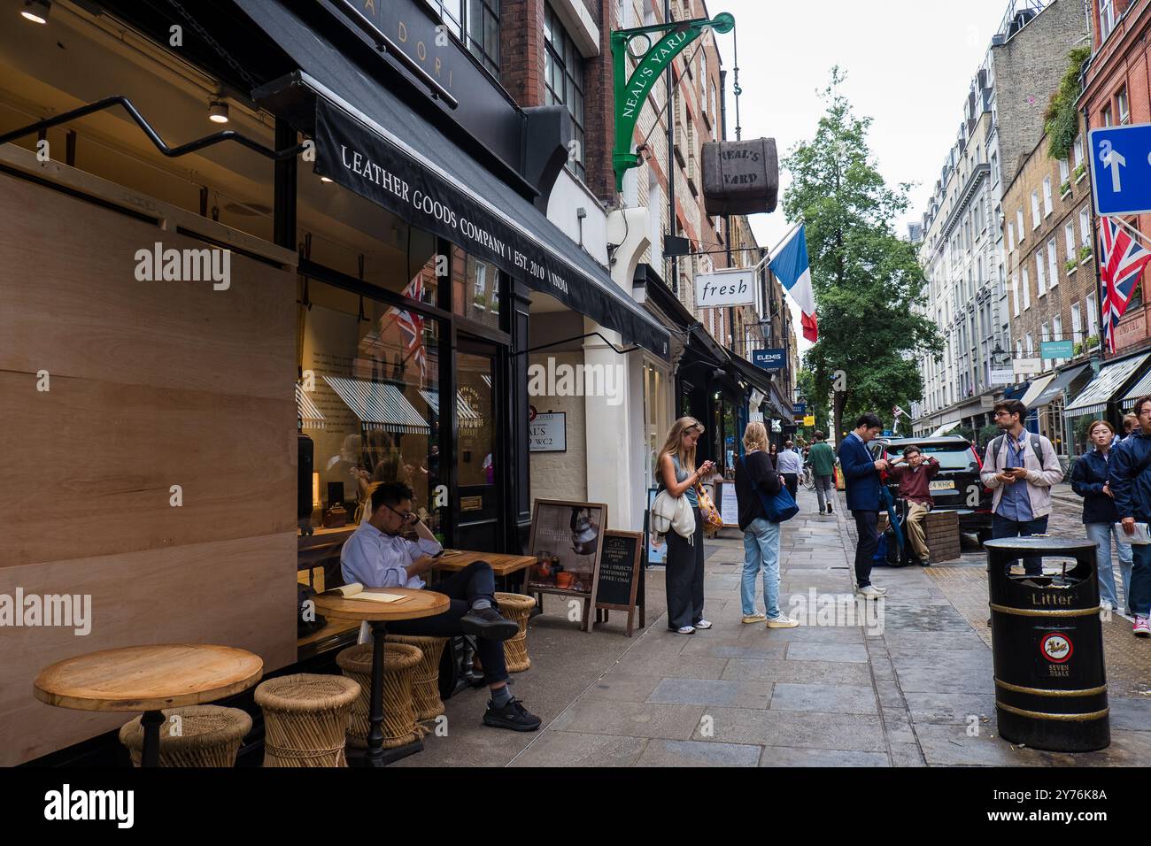 London, UK - July 25, 2024: Colurful Neals Yard courtyard. Neal's Yard is a small alley in London's Covent Garden. Popular tourist spot. Stock Photo