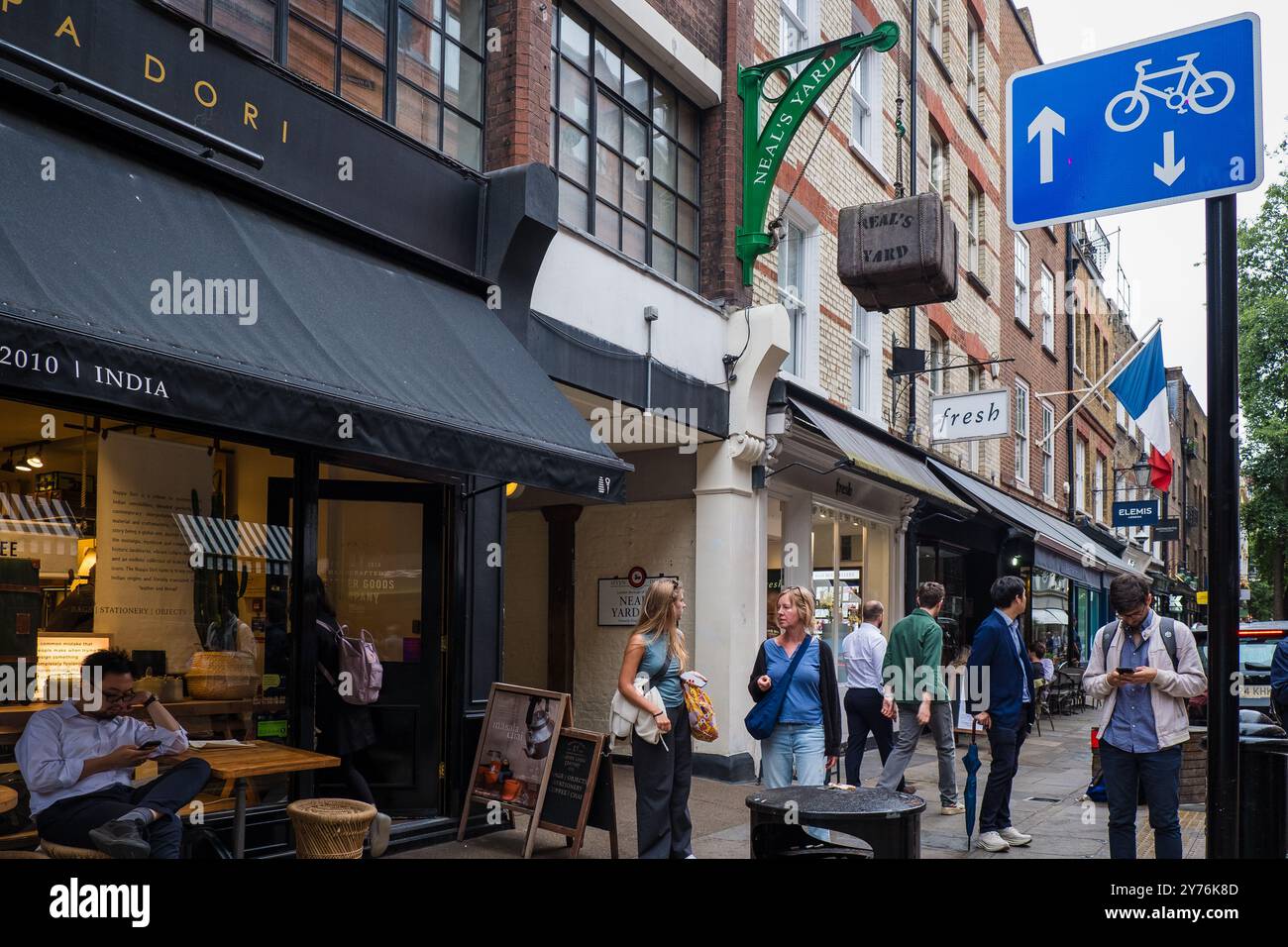 London, UK - July 25, 2024: Colurful Neals Yard courtyard. Neal's Yard is a small alley in London's Covent Garden. Popular tourist spot. Stock Photo