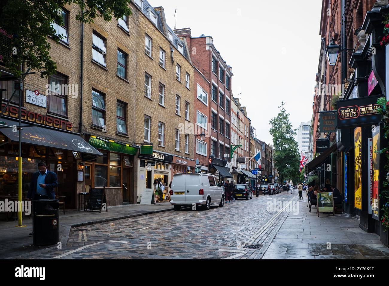 London, UK - July 25, 2024: Colurful Neals Yard courtyard. Neal's Yard is a small alley in London's Covent Garden. Popular tourist spot. Stock Photo
