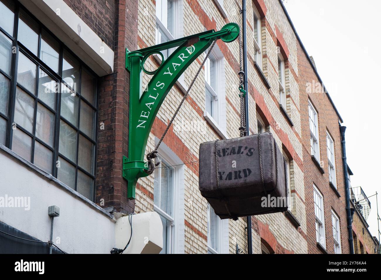 London, UK - July 25, 2024: Colurful Neals Yard courtyard. Neal's Yard is a small alley in London's Covent Garden. Popular tourist spot. Stock Photo