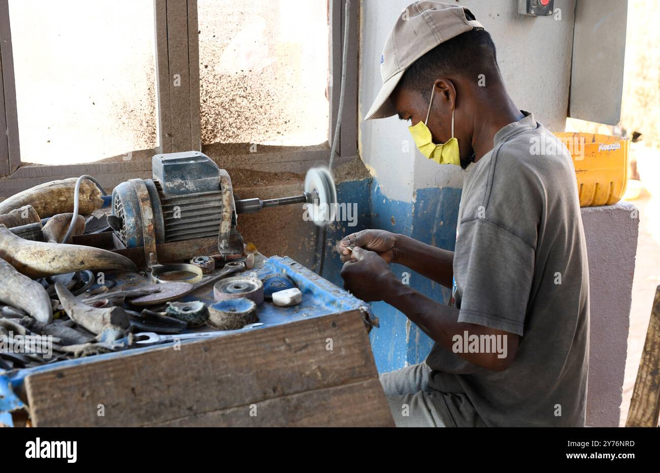 Antsirabe, workshop on making objects with zebu horn. Artisanal worker. Vakinankaratra region, Madagascar. Stock Photo