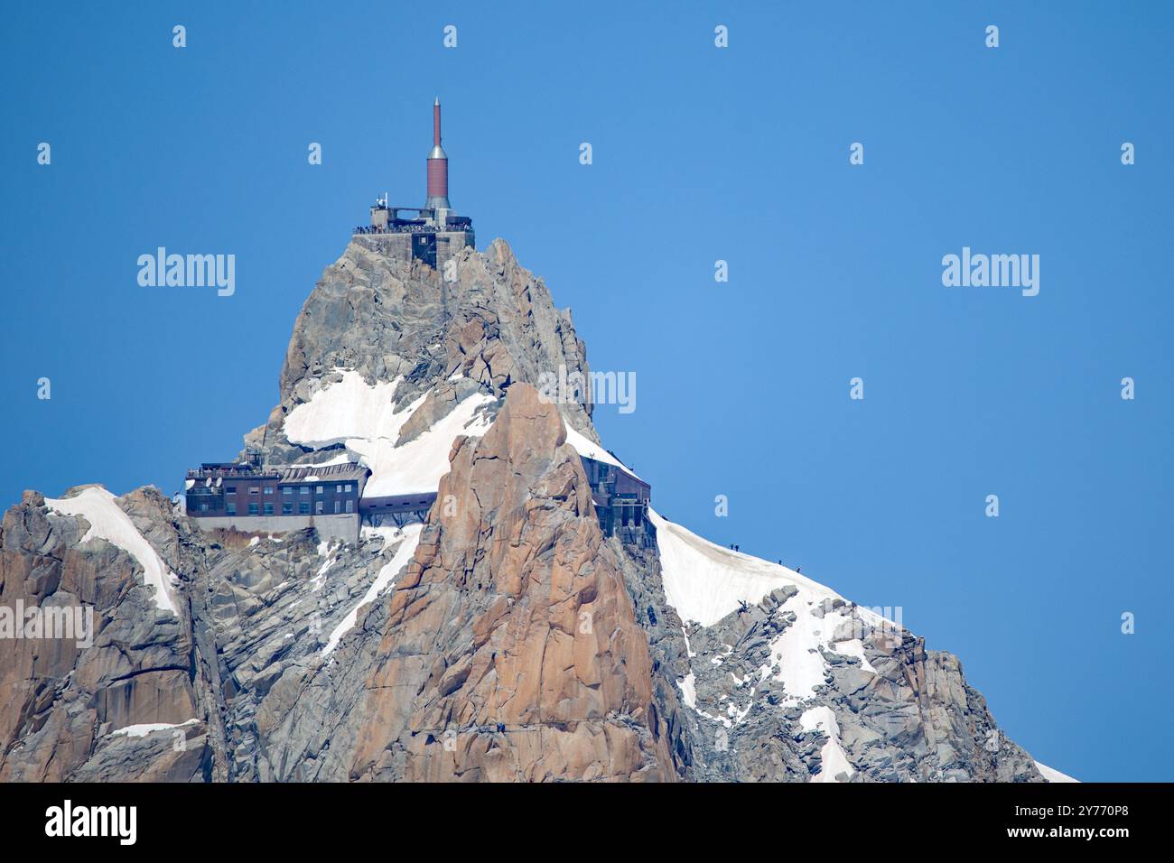 view from below of the station aiguille du midi on the mountain with a ...