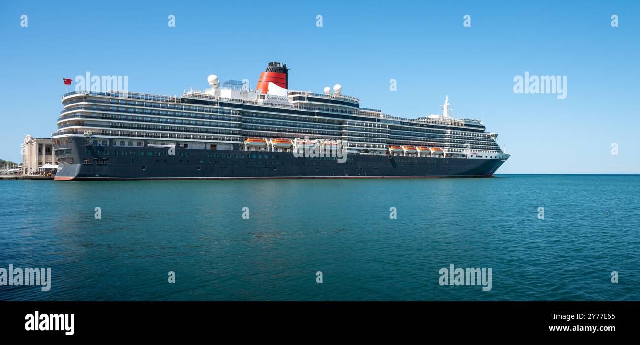 Trieste, Italy - July 29, 2024: Cunard Cruise ship Queen Victoria in port of Trieste, Italy. Side View. Stock Photo