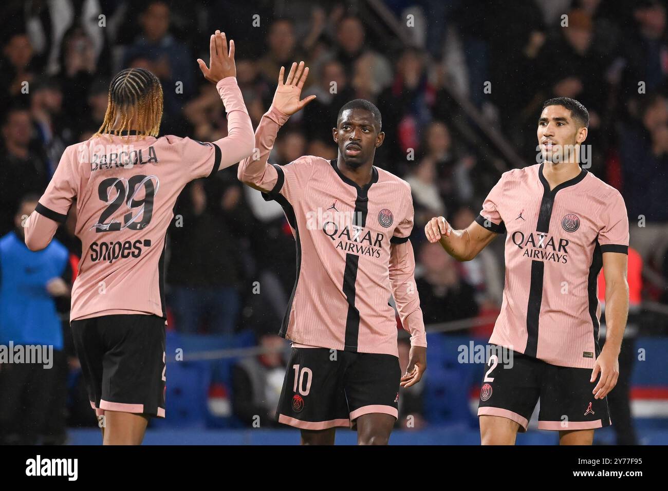 Paris, France. 28th Sep, 2024. Julien Mattia/Le Pictorium - 6e Journee de ligue 1 : PSG-Stade Rennais at Parc des Princes, on September 27th 2024 - 28/09/2024 - France/Ile-de-France (region)/Paris - Celebration of Bradley Barcola (L), Ousmane Dembele (C) and Achraf Hakimi (R) during the 6th Journee de ligue 1 Mc Donald's, between PSG and Stade Rennais at Parc des Princes, September 27, 2024 Credit: LE PICTORIUM/Alamy Live News Stock Photo