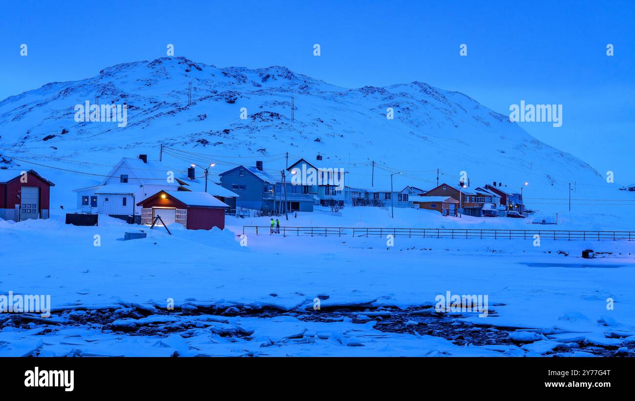Skarsvåg village, Nordkapp municipality, during a blue hour on a snowy winter day (Nordkapp, Finnmark, Norway) ESP: Pueblo de Skarsvåg, en Nordkapp Stock Photo