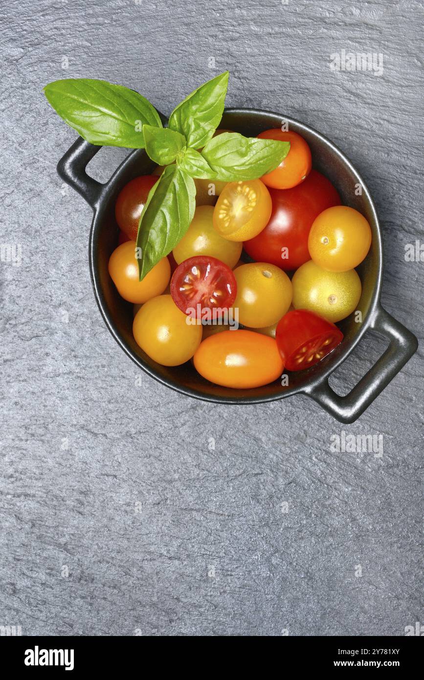 Various cherry tomatoes in pots, cherry tomato Stock Photo