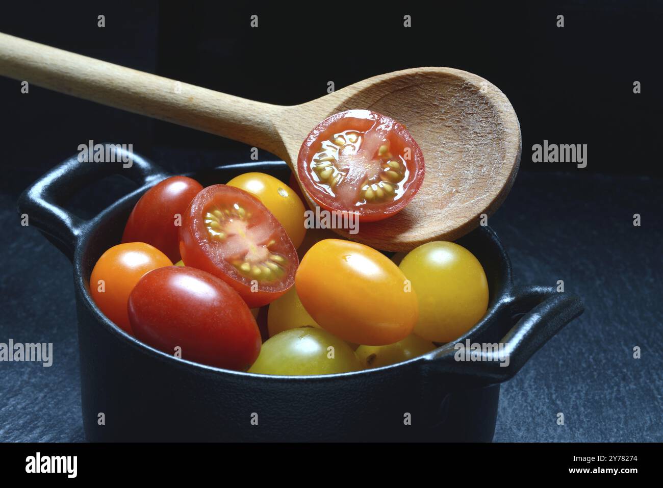 Various cherry tomatoes in pots, cherry tomato Stock Photo