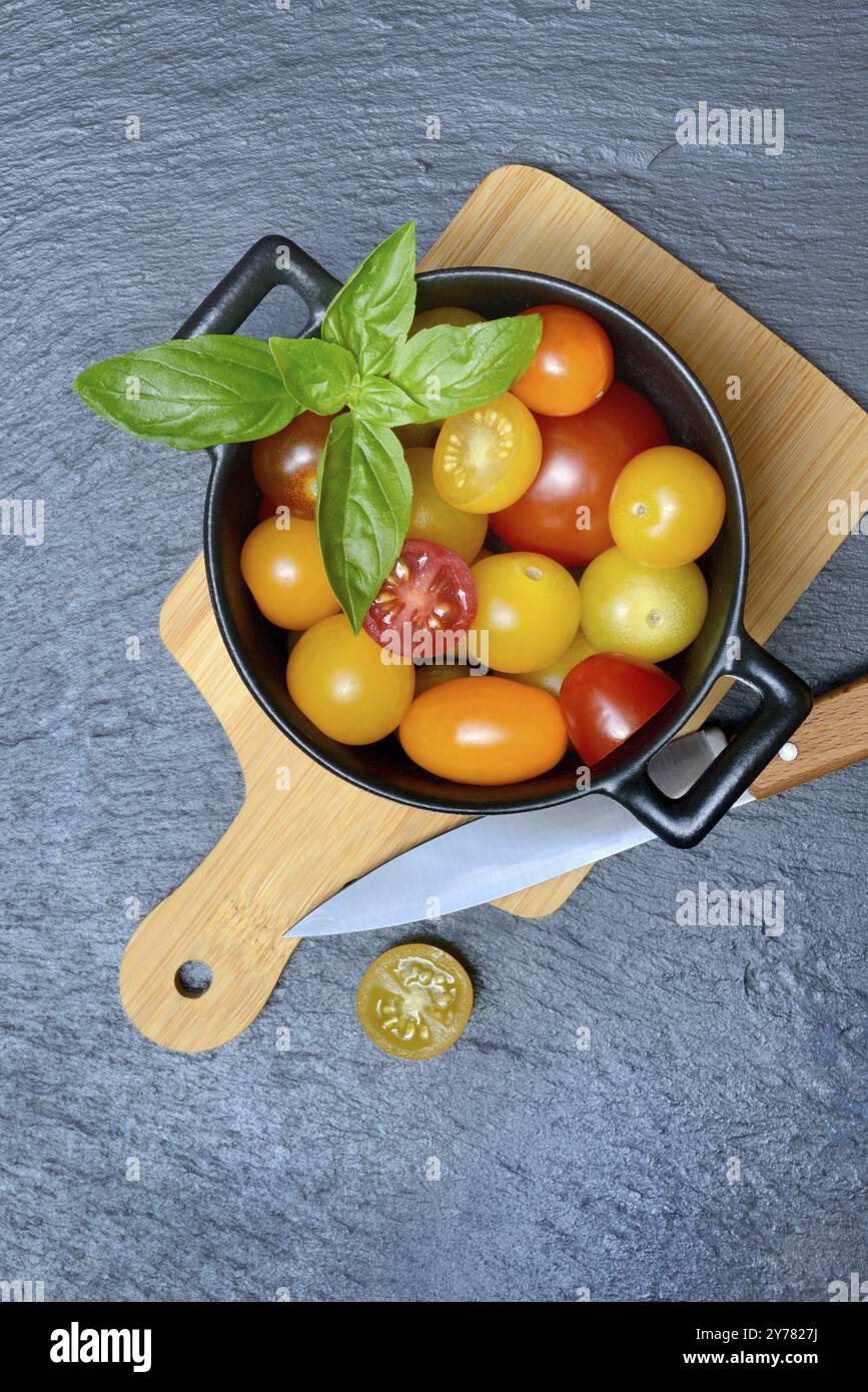 Various cherry tomatoes in pots, cherry tomato Stock Photo