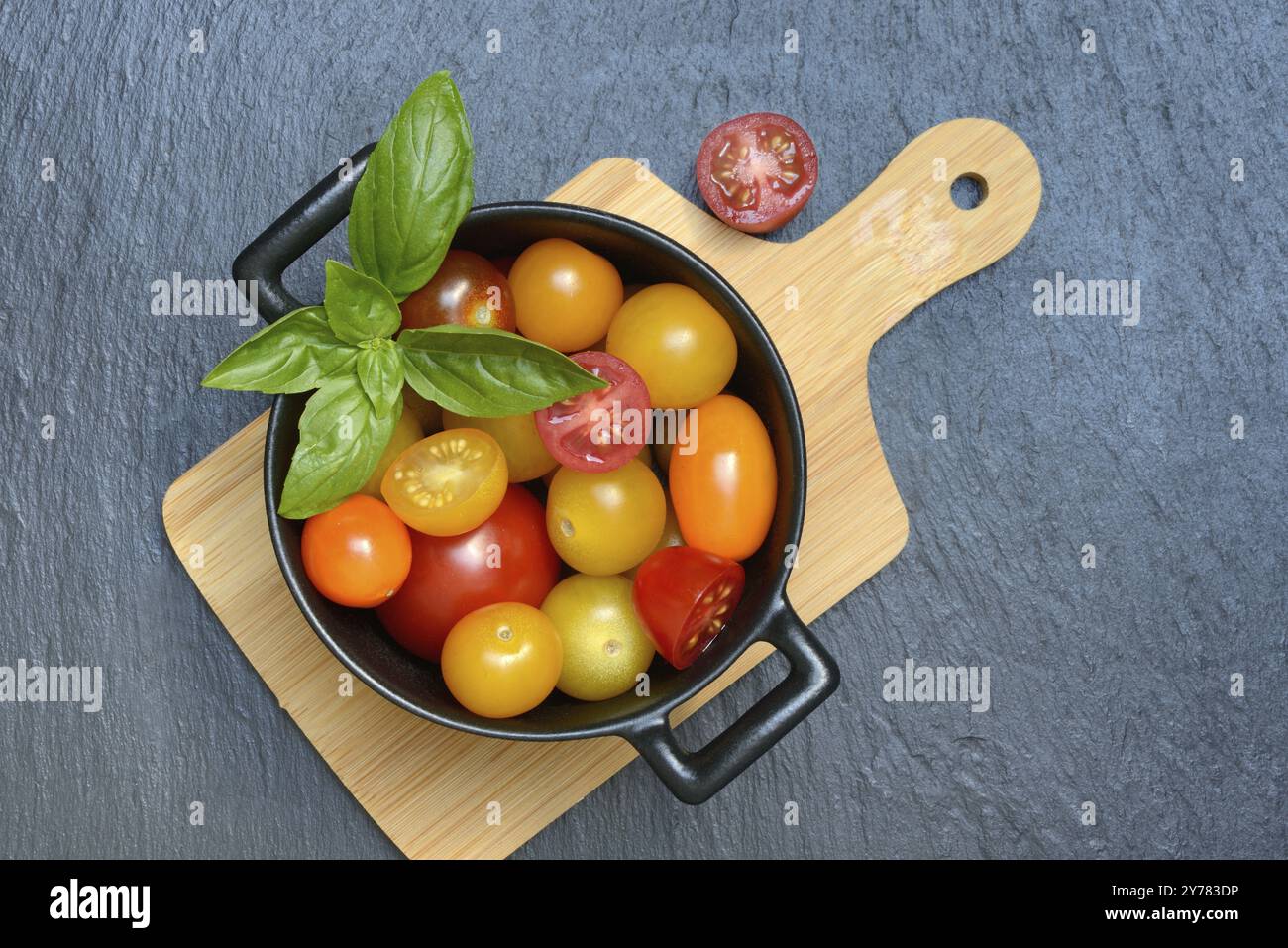 Various cherry tomatoes in pots, cherry tomato Stock Photo