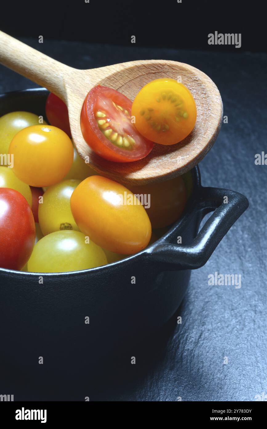 Various cherry tomatoes in pots, cherry tomato Stock Photo