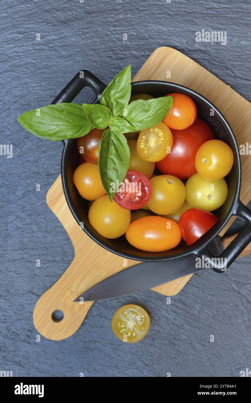 Various cherry tomatoes in pots, cherry tomato Stock Photo
