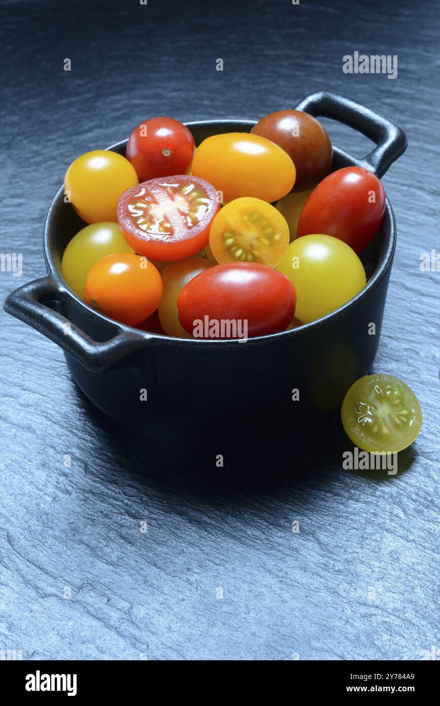 Various cherry tomatoes in pots, cherry tomato Stock Photo