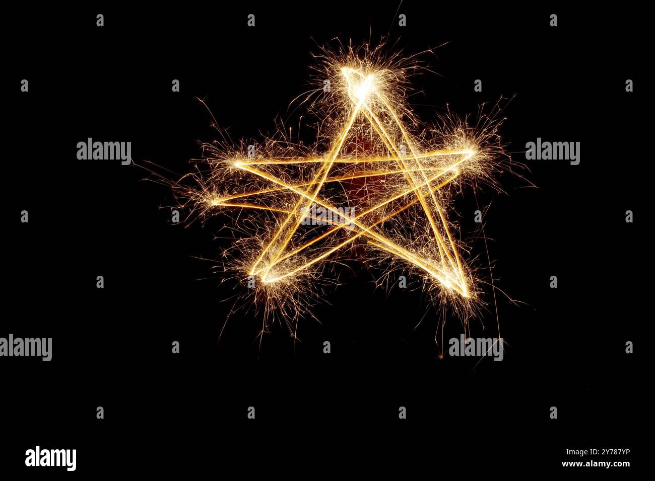 Sparkler firework light with star shape isolated on black background Stock Photo