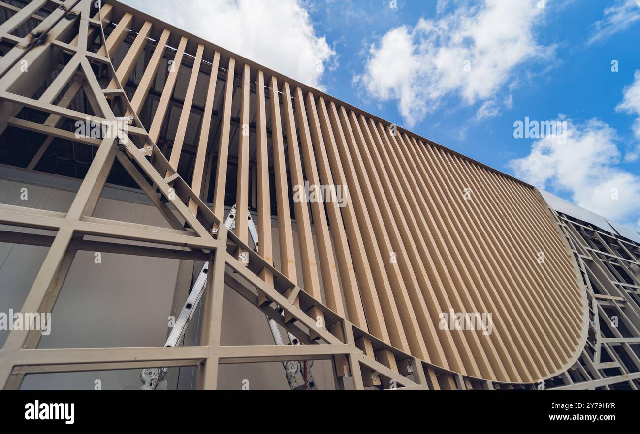 A structure featuring wooden slats on construction site contributing to ...