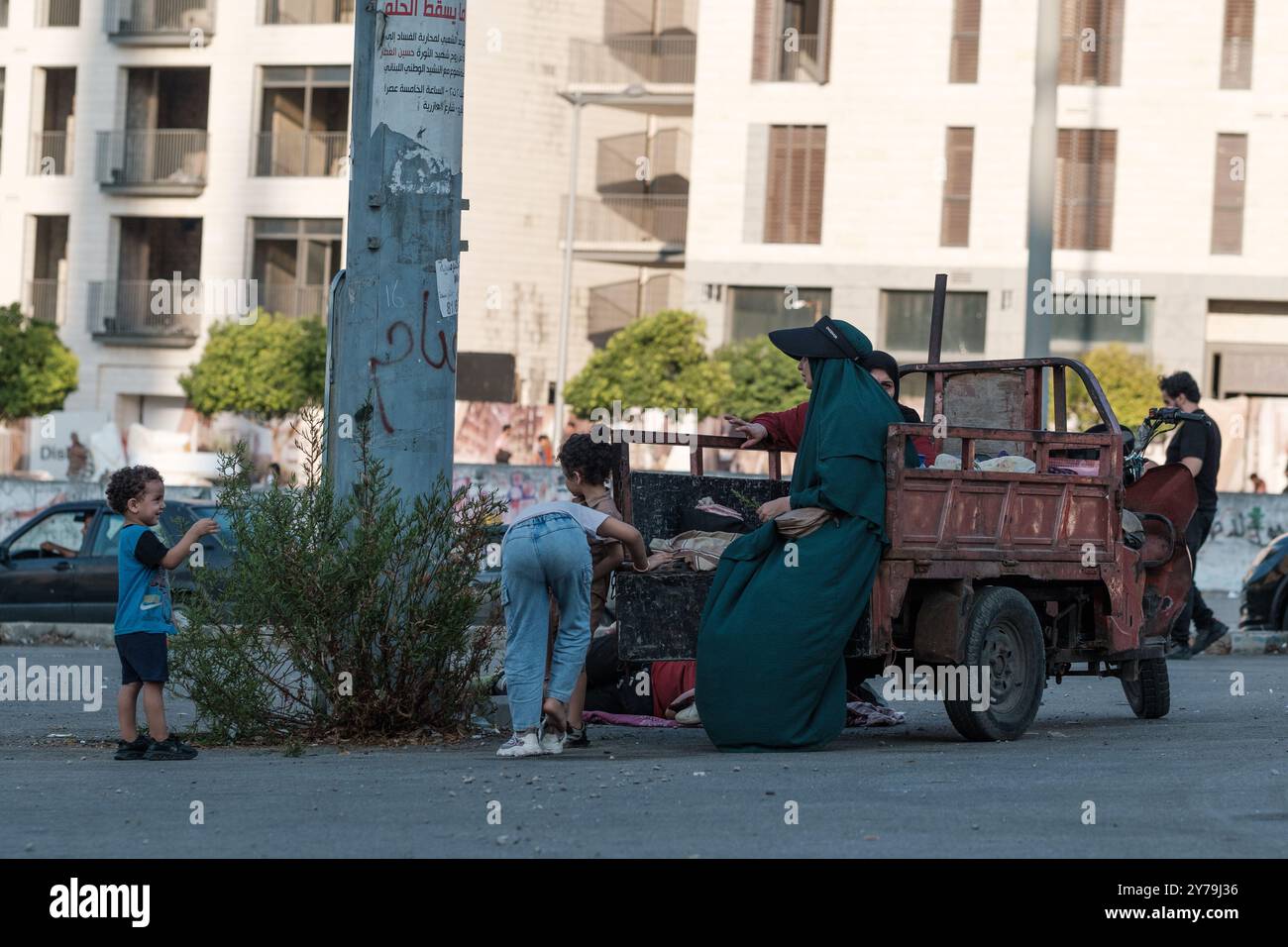 Displaced residents from Dahiyeh, the southern suburbs of Beirut, have taken to the streets and parks of the city after a night of heavy bombing that left many dead and missing. Among the casualties are Hezbollah leader Hassan Nasrallah and several other senior commanders and fighters. The attack has caused widespread devastation, forcing families to flee their homes in search of safety. The bombardment of civilian homes and refugee shelters in Lebanon has created an escalating crisis with almost half a million displaced civilians searching for a safe place to shelter from Israel's bombs. Beir Stock Photo