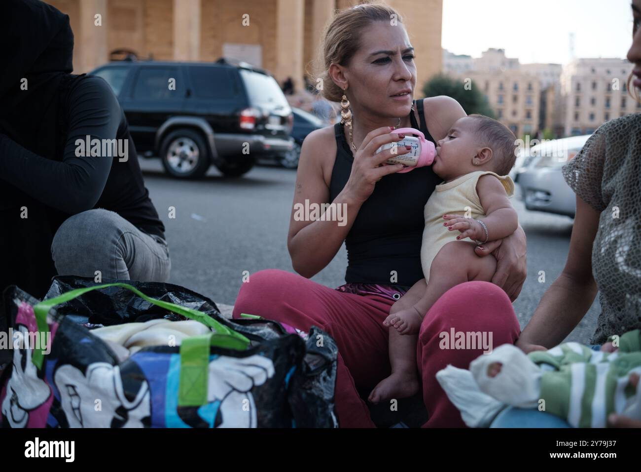 Displaced residents from Dahiyeh, the southern suburbs of Beirut, have taken to the streets and parks of the city after a night of heavy bombing that left many dead and missing. Among the casualties are Hezbollah leader Hassan Nasrallah and several other senior commanders and fighters. The attack has caused widespread devastation, forcing families to flee their homes in search of safety. The bombardment of civilian homes and refugee shelters in Lebanon has created an escalating crisis with almost half a million displaced civilians searching for a safe place to shelter from Israel's bombs. Beir Stock Photo