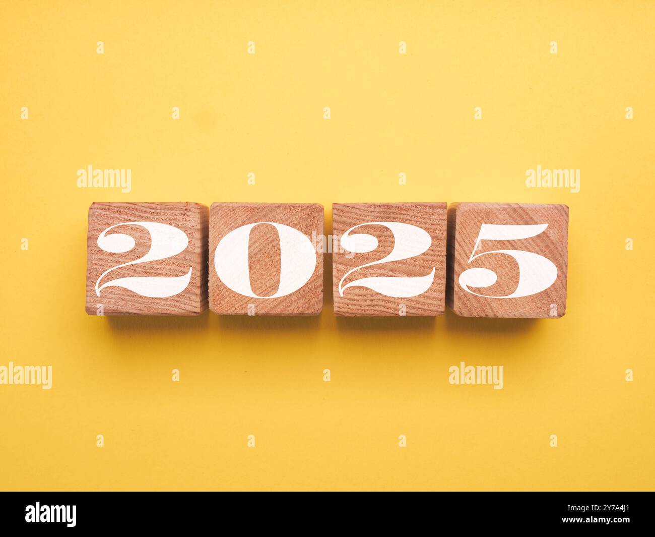 Wooden blocks with the Year number 2025 on a yellow background, New ...