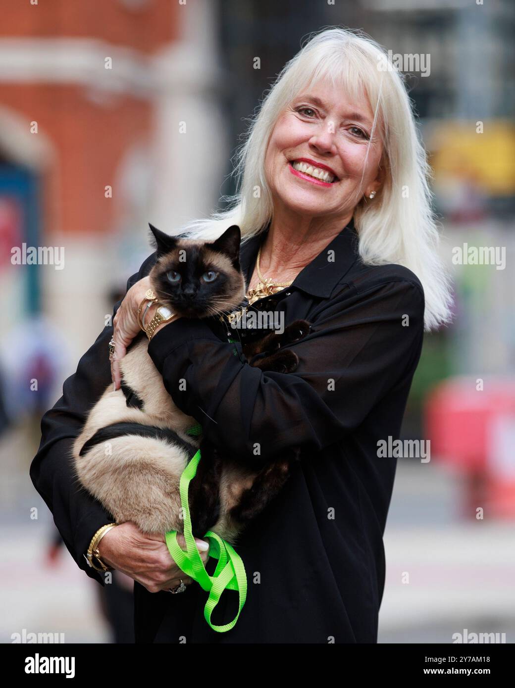 Holly Hennessy with her Siamese cat Captain at the Europa Hotel in