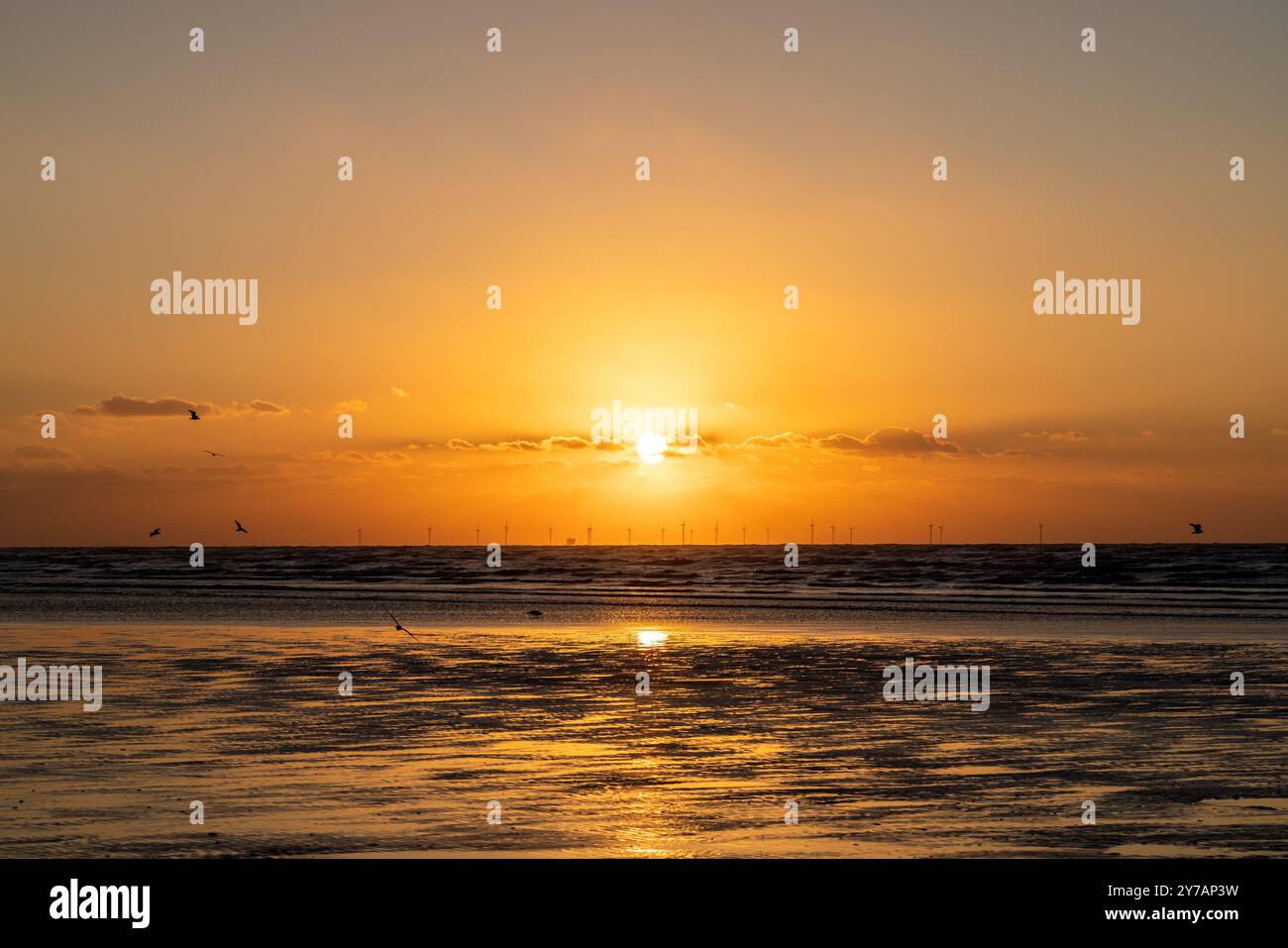 A stunning natural landscape featuring a vibrant sunset with the sun ...