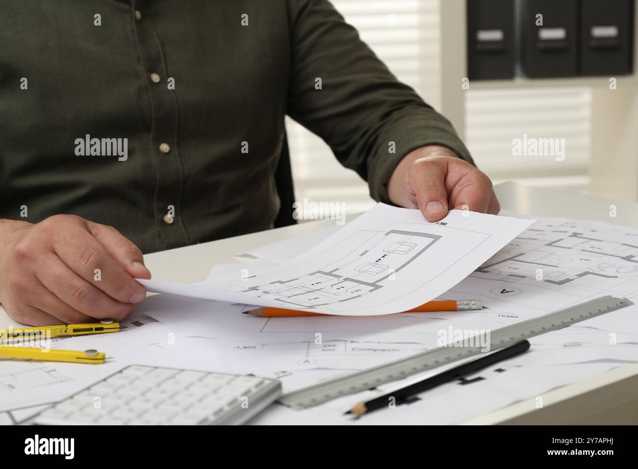 Architect working with project, closeup. Different technical drawings ...