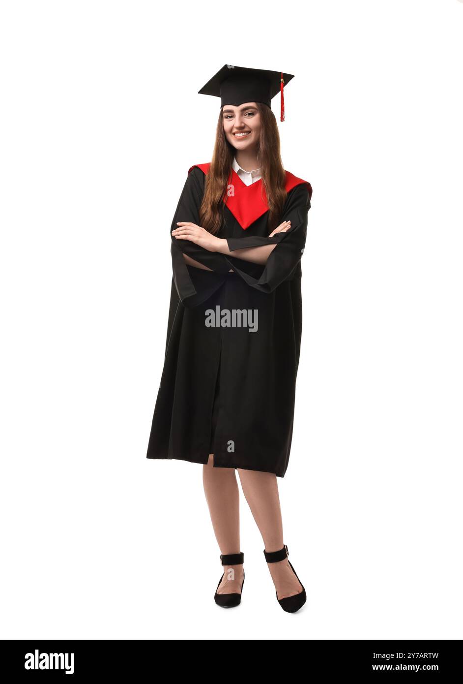 Happy student with crossed arms after graduation on white background ...
