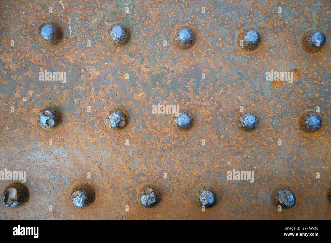 Riveted rusty steel rail bridge close up for textures and patterns ...