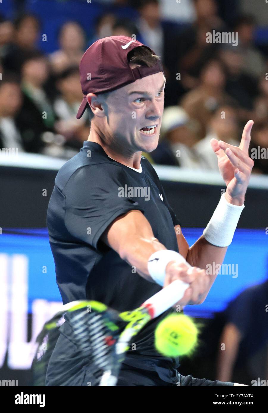 Tokyo, Japan. 29th Sep, 2024. Holger Rune of Denmark retuens the ball ...