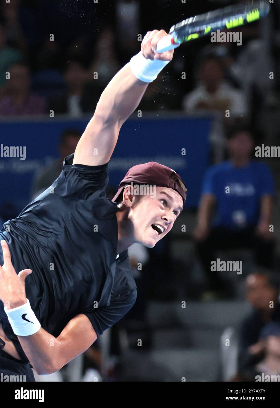 September 29, 2024, Tokyo, Japan - Holger Rune of Denmark delivers a ...