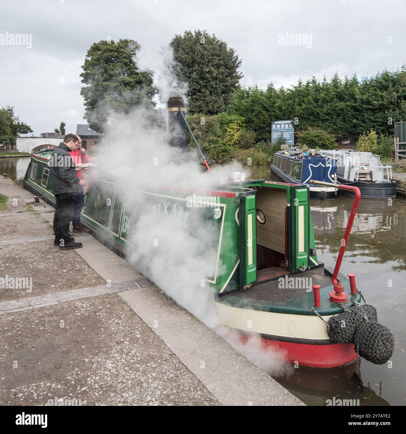 'Tixall', a steam driven narrowboat parked up near the low  road bridge that leads to the Wardle Canal,Middlewitch Cheshire .Seen  late September 2024. Stock Photo