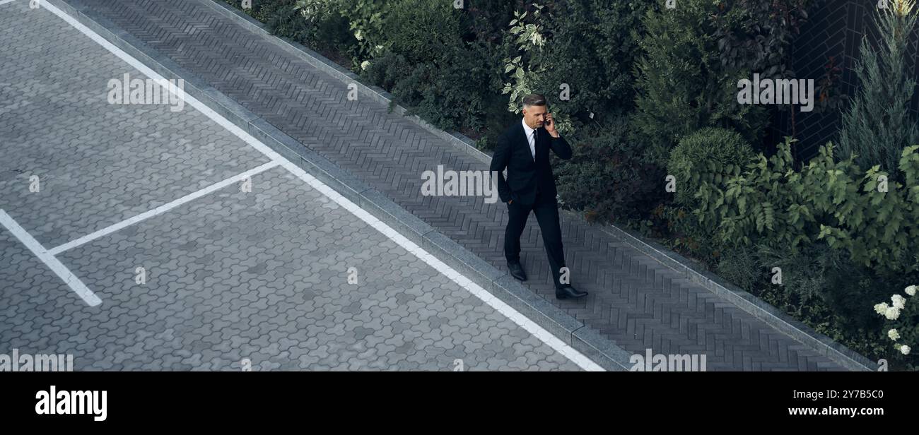 Business man walking top building hi-res stock photography and images ...