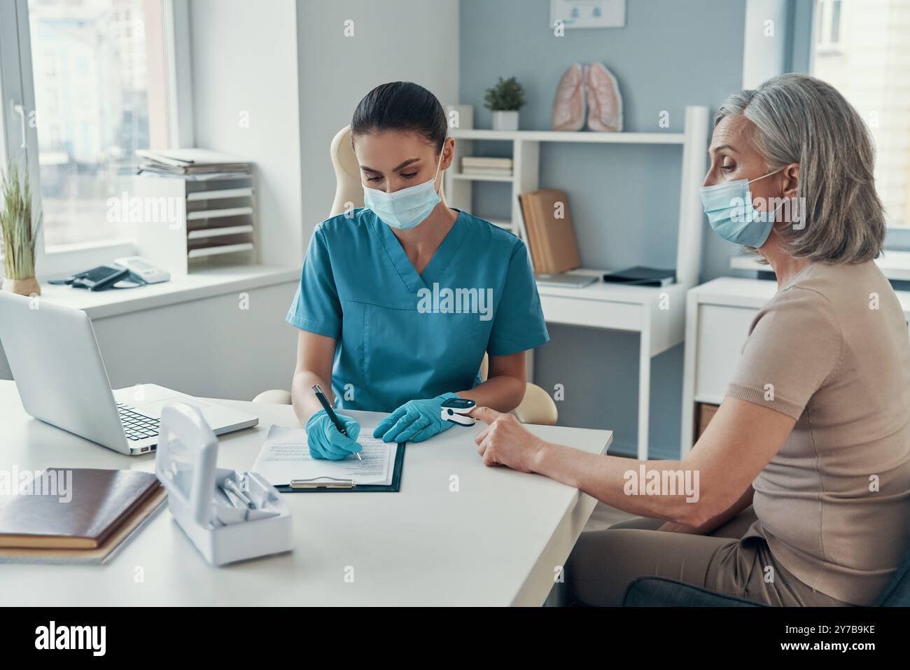 Female paramedic using face hi-res stock photography and images - Alamy
