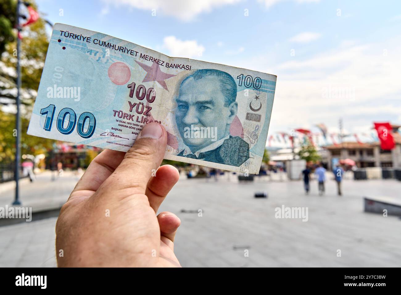 Istanbul Turkey September 2 2024 A Person Holds A 100 Turkish Lira istanbul-turkey-september-2-2024-a-person-holds-a-100-turkish-lira