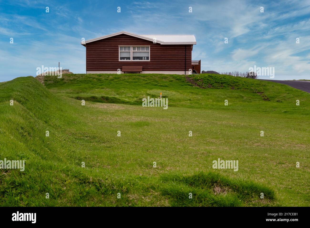 Secluded Wooden Retreat Amidst Iceland’s Verdant Hills - A Tranquil Escape from the Bustle Stock Photo