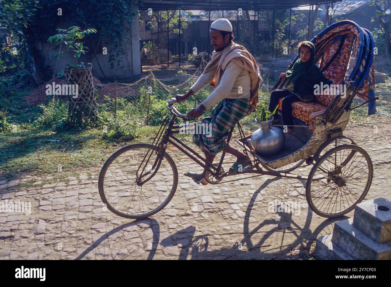 RICKSHAW DRIVER TAKING CHILD TO SCHOOL IN KHULNA, BANGLADESH Stock ...