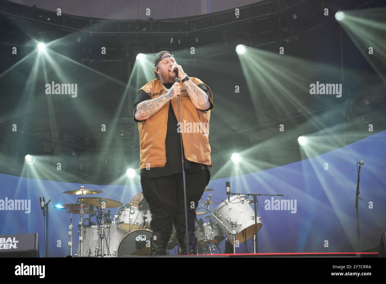 Jelly Roll performing energetically onstage at the Global Citizen