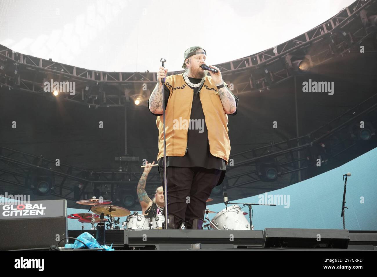 Jelly Roll performing energetically onstage at the Global Citizen