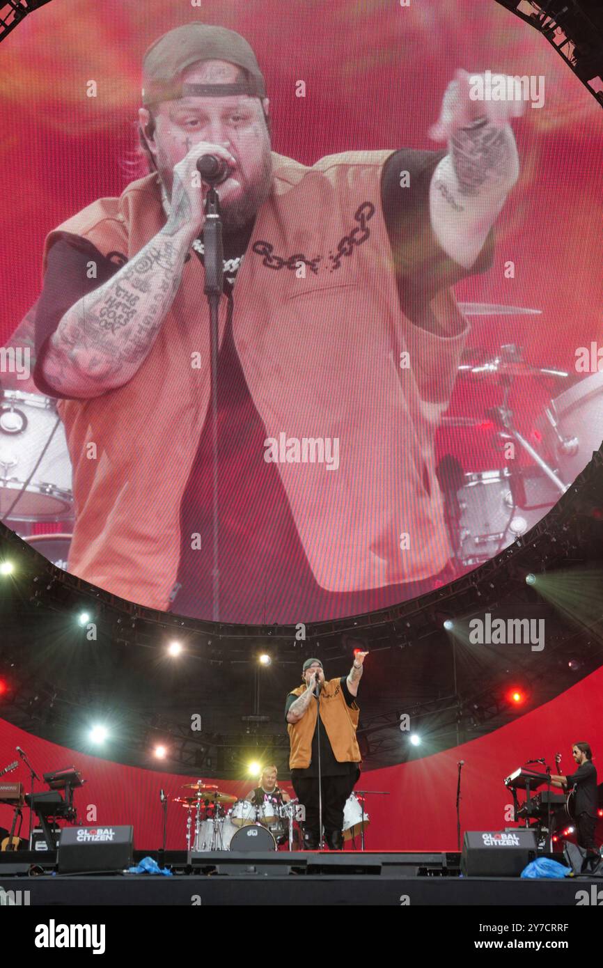 Jelly Roll performing energetically onstage at the Global Citizen