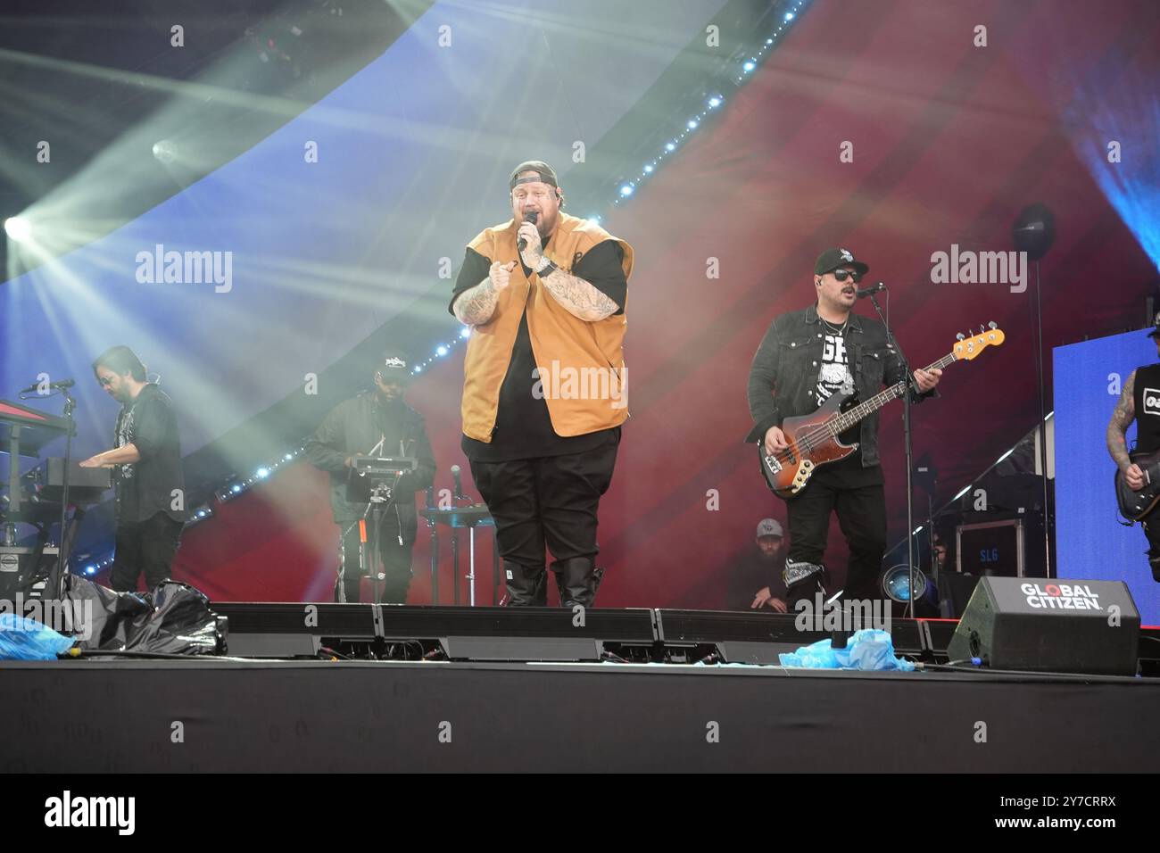 Jelly Roll performing energetically onstage at the Global Citizen