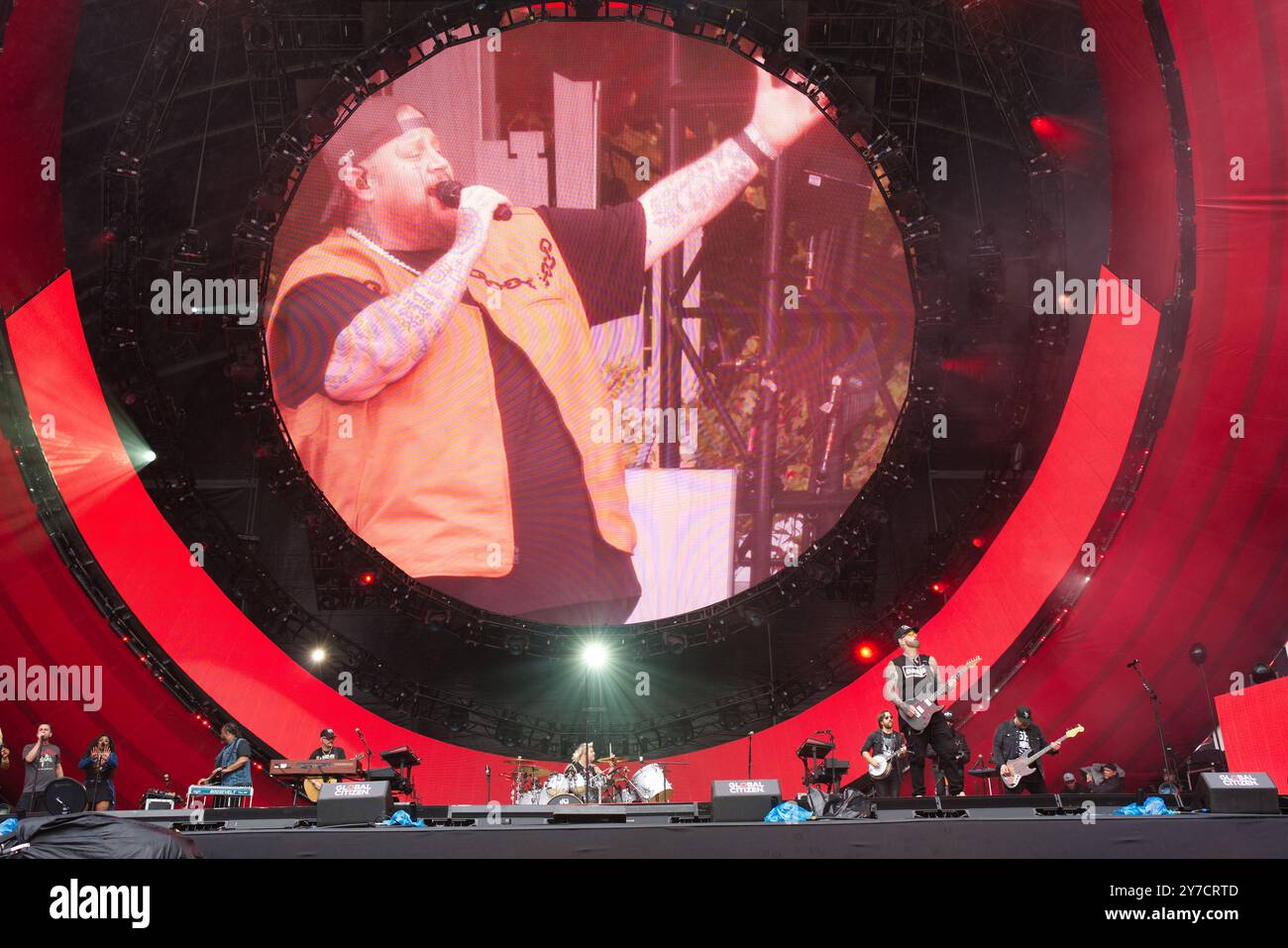 Jelly Roll performing energetically onstage at the Global Citizen