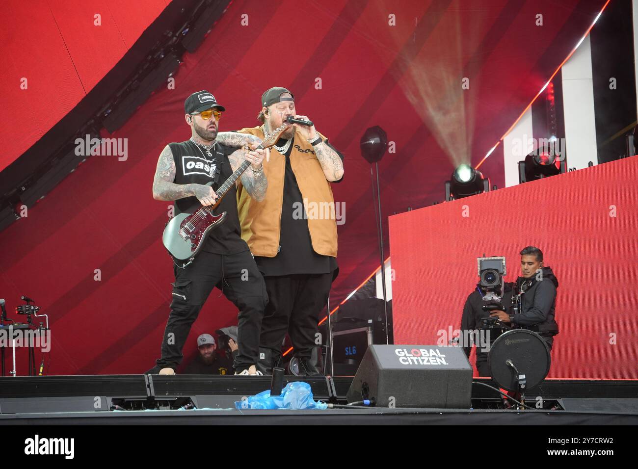 Jelly Roll performing energetically onstage at the Global Citizen