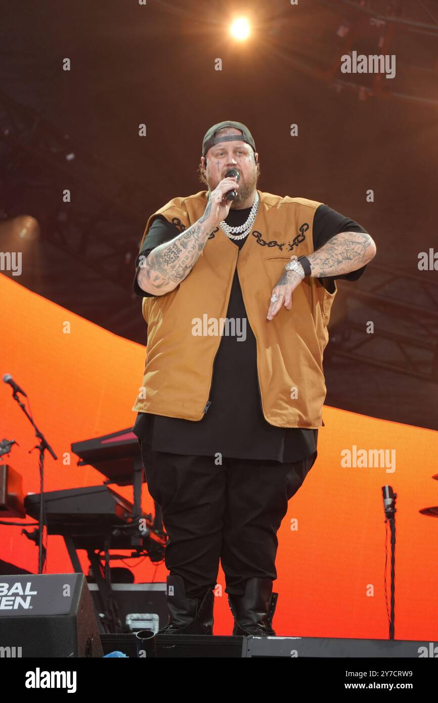 Jelly Roll performing energetically onstage at the Global Citizen